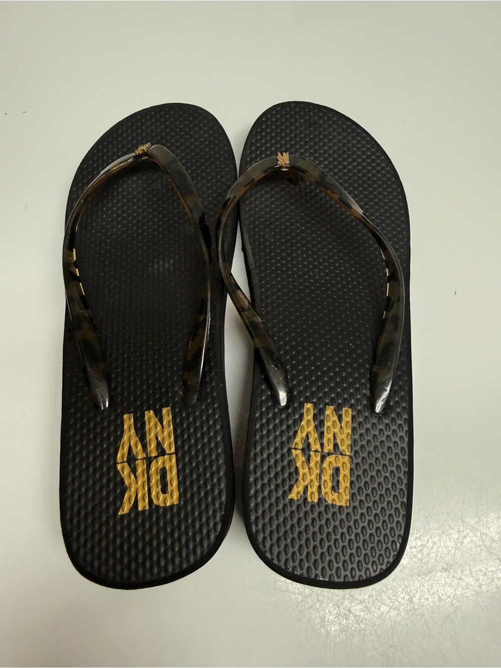 DKNY Black women size 6 Flip Flop Sandals with Gold Logo